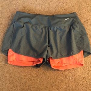 size: small grey and orange Nike athletic shorts